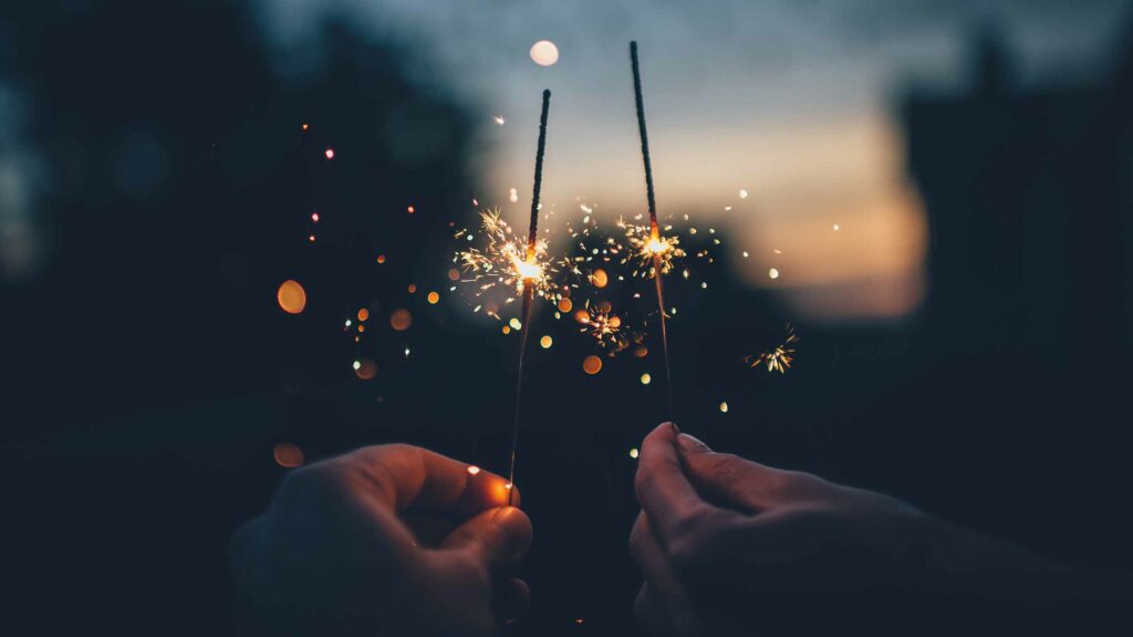 Two lit sparklers