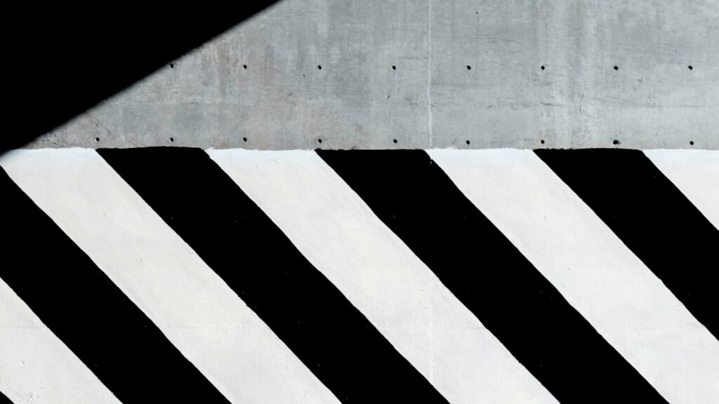 Black and white stripes on a concrete wall
